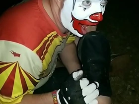 Clown worshiping size 12 muddy shoes