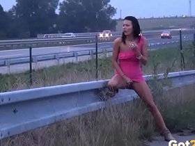 Public pissing on the highway for sexy brunette