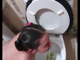 Pigtailed teen sucks dick after being pissed on and licking the toilet clean face spitting and slapping