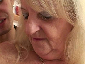Blonde granny in stockings rides stranger's cock