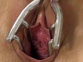 Seductive baby spreads pussy about speculum